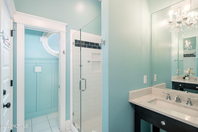 bathroom featuring vanity, tile patterned flooring, and walk in shower