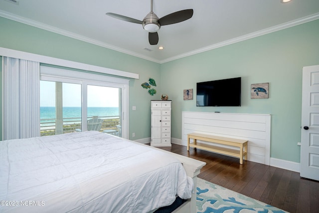 bedroom featuring access to exterior, crown molding, dark wood-type flooring, and a water view