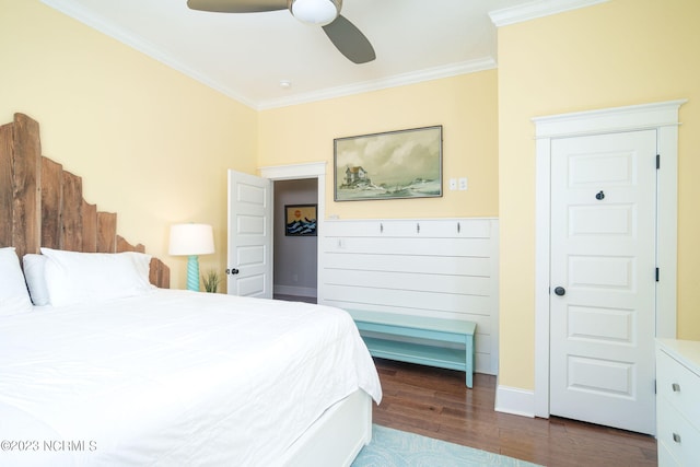 bedroom with ceiling fan, ornamental molding, and dark hardwood / wood-style floors