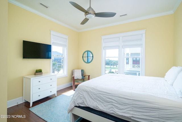 bedroom featuring ceiling fan, ornamental molding, and dark hardwood / wood-style flooring