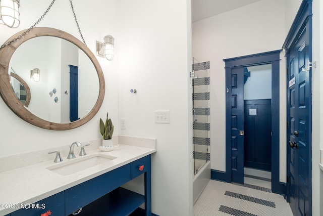 bathroom with tile patterned floors,  shower combination, and vanity