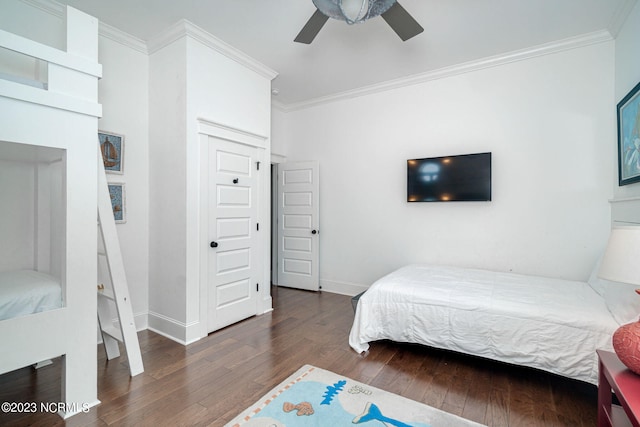 bedroom featuring ornamental molding, dark wood-type flooring, and ceiling fan