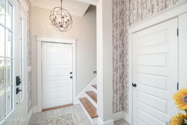 foyer with an inviting chandelier