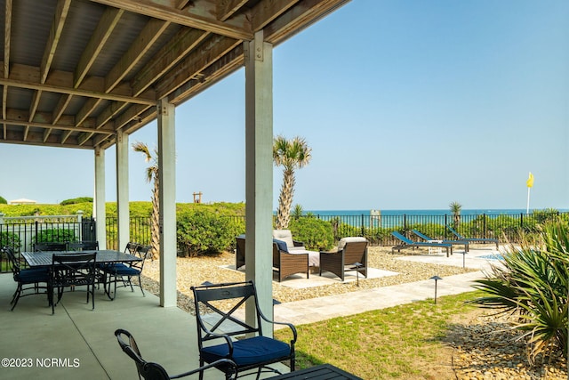 view of patio featuring a water view