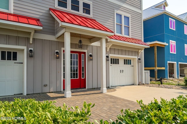 view of exterior entry with a garage