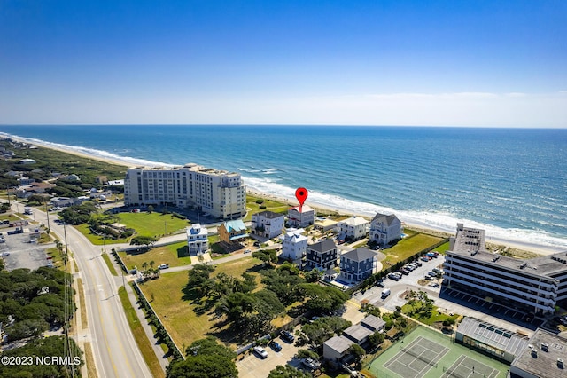 drone / aerial view with a beach view and a water view