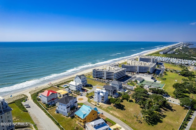 aerial view featuring a water view and a beach view