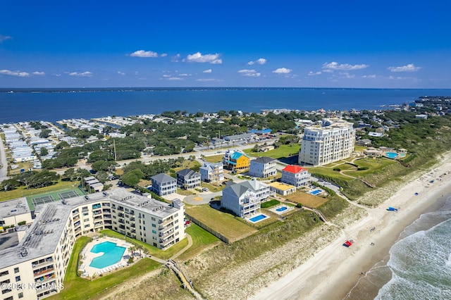 drone / aerial view with a water view and a view of the beach