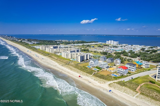 bird's eye view featuring a view of the beach and a water view