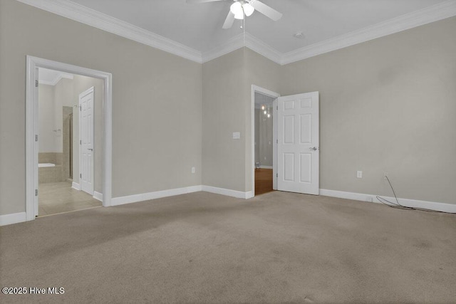 empty room featuring baseboards, carpet floors, ceiling fan, and crown molding