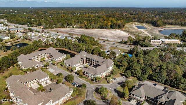 birds eye view of property featuring a residential view and a view of trees