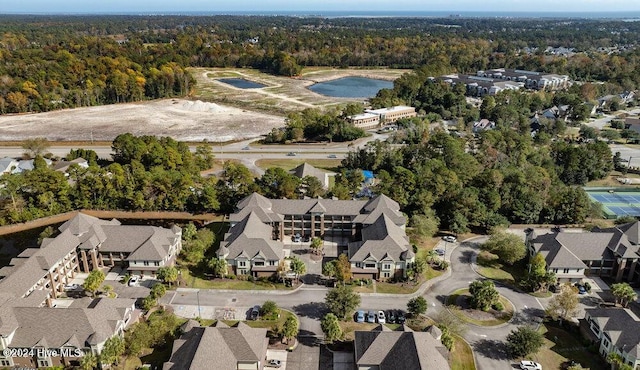 bird's eye view featuring a forest view and a residential view