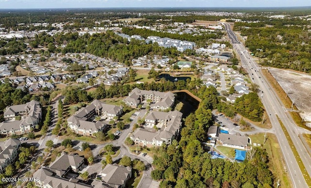 birds eye view of property with a residential view