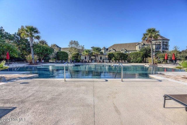 pool with a patio area