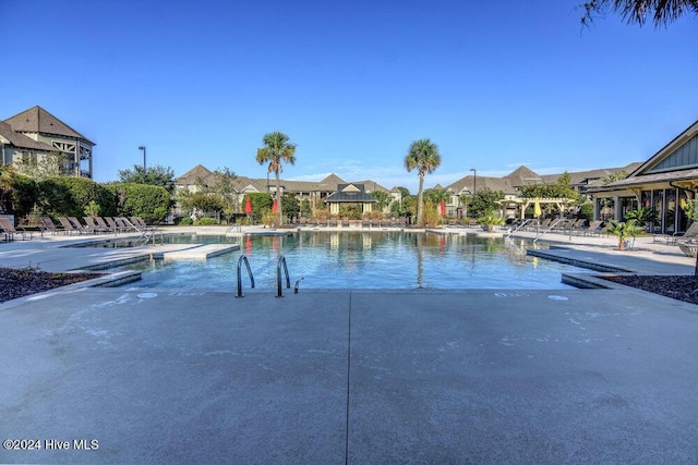 community pool featuring a patio area