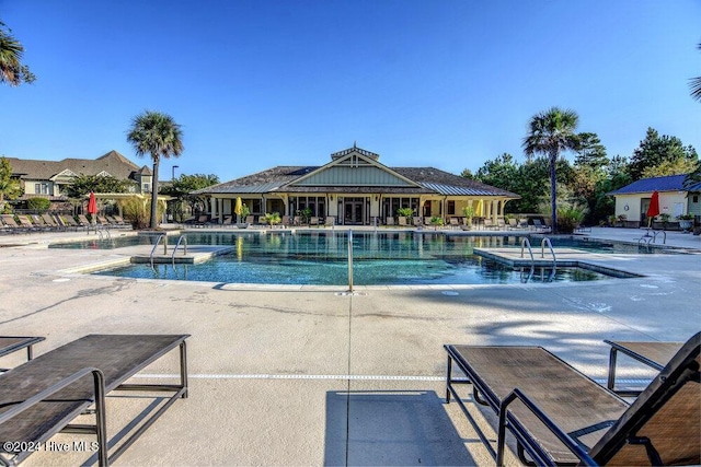 community pool with a patio area