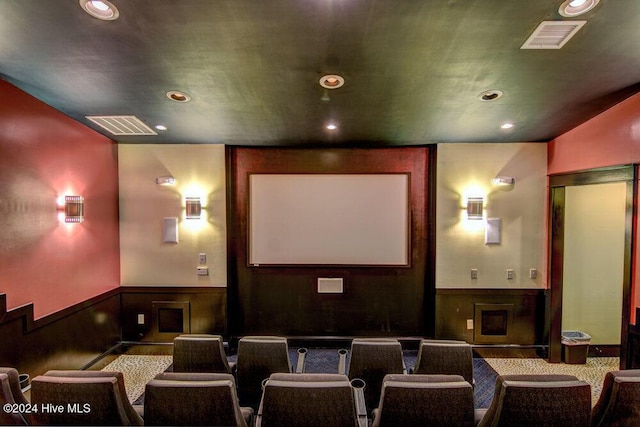 home theater room featuring a wainscoted wall, visible vents, and recessed lighting