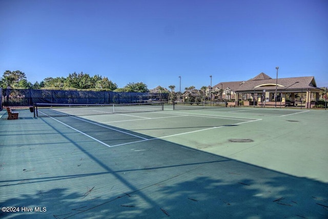 view of sport court with fence