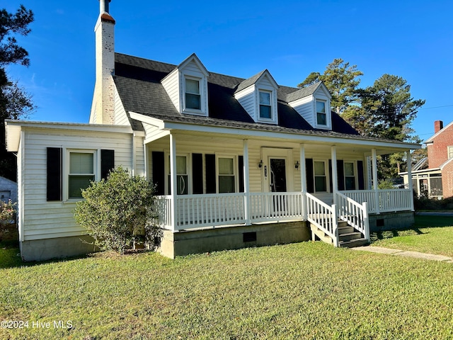 cape cod-style house with a porch and a front lawn