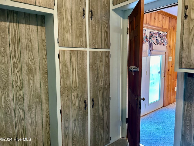 interior space featuring wood walls