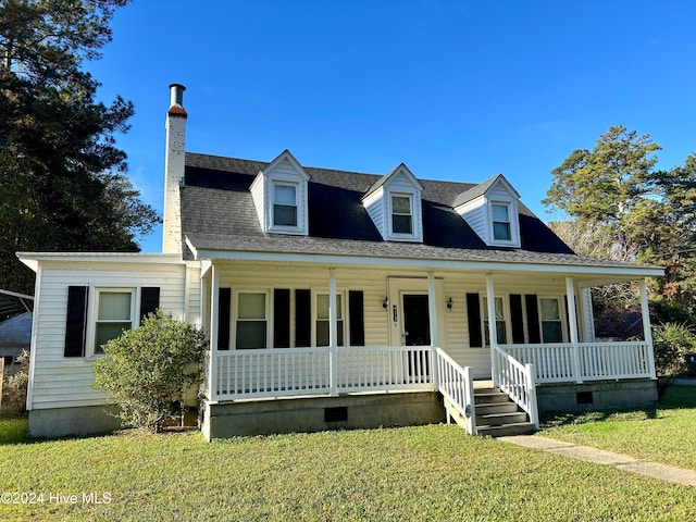 cape cod home featuring a porch and a front yard