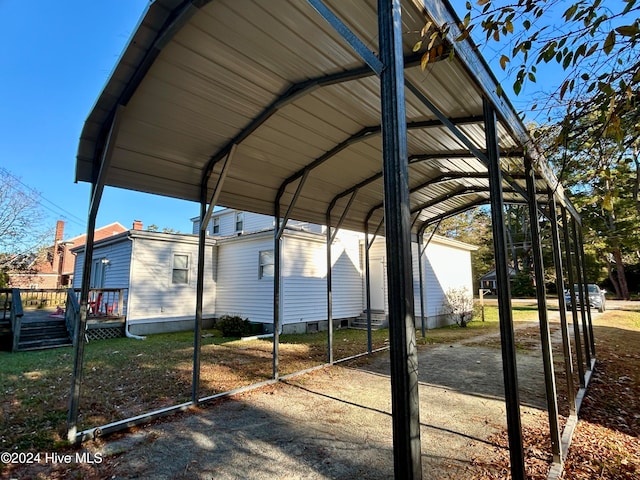 view of vehicle parking with a carport