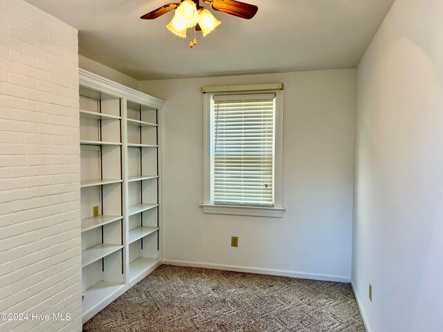 unfurnished room with light carpet and ceiling fan