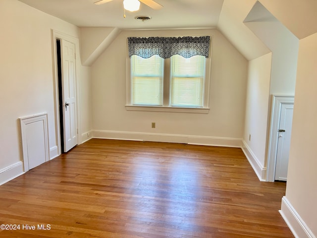 bonus room featuring light hardwood / wood-style floors, lofted ceiling, and ceiling fan