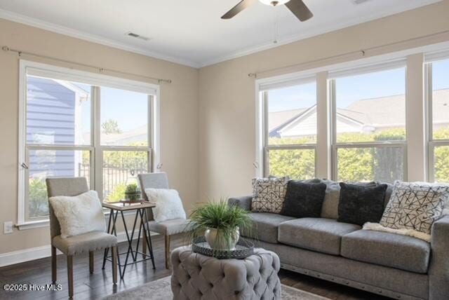 4104 Passerine Ave, Wilmington, NC 28412 - living area featuring visible vents, ornamental molding, baseboards, dark wood-style floors, and a ceiling fan
