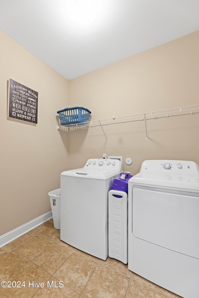 4104 Passerine Ave, Wilmington, NC 28412 - clothes washing area with light tile patterned floors, baseboards, laundry area, and washer and dryer
