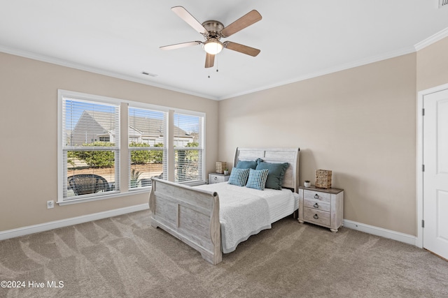 bedroom featuring baseboards, visible vents, crown molding, and carpet flooring