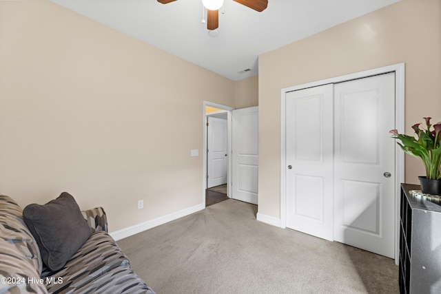 sitting room featuring light carpet, ceiling fan, and baseboards