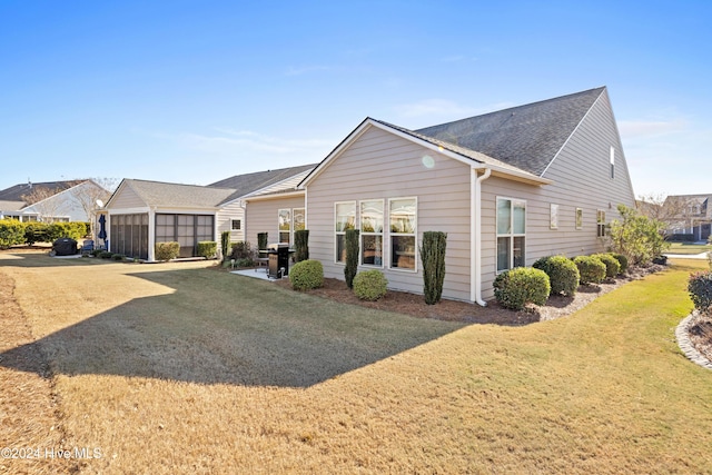 exterior space with a patio and a front yard