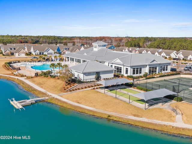 bird's eye view with a water view and a residential view