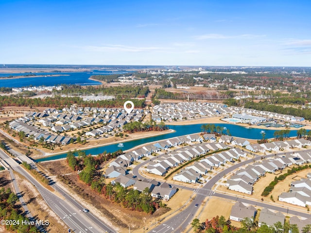 bird's eye view with a residential view and a water view