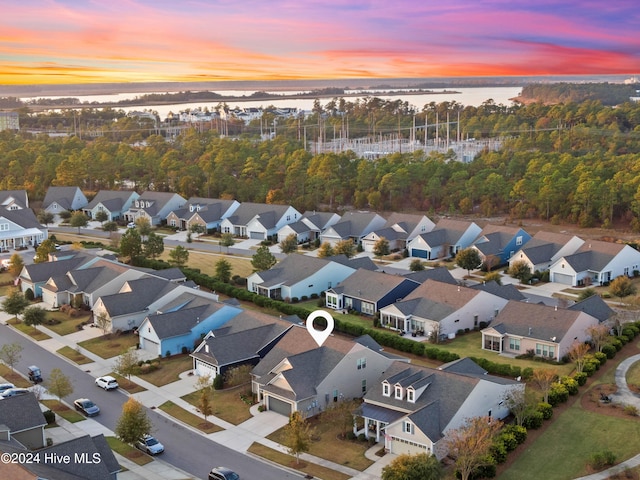 bird's eye view with a water view and a residential view