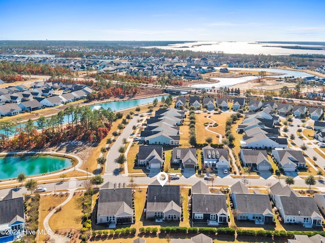 bird's eye view with a water view and a residential view