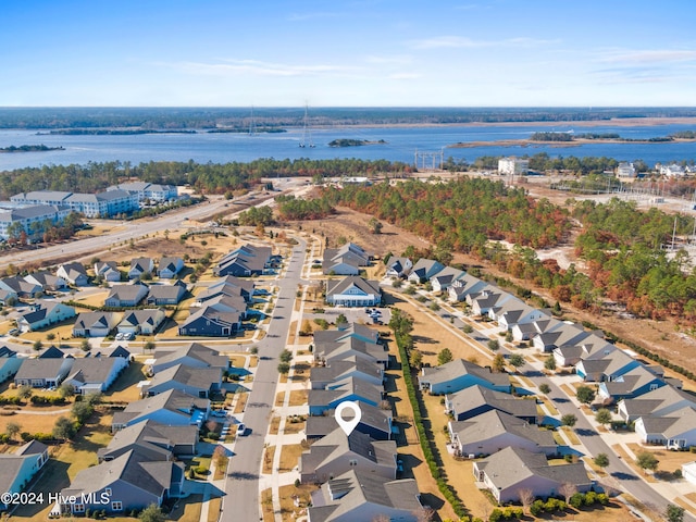 bird's eye view featuring a water view and a residential view