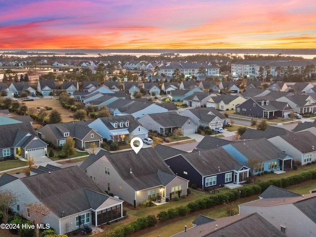 4104 Passerine Ave, Wilmington, NC 28412 - aerial view at dusk featuring a residential view
