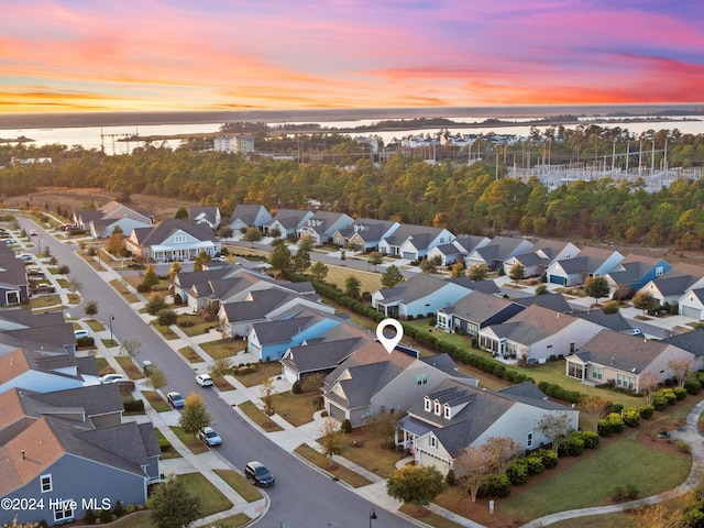 bird's eye view featuring a water view and a residential view