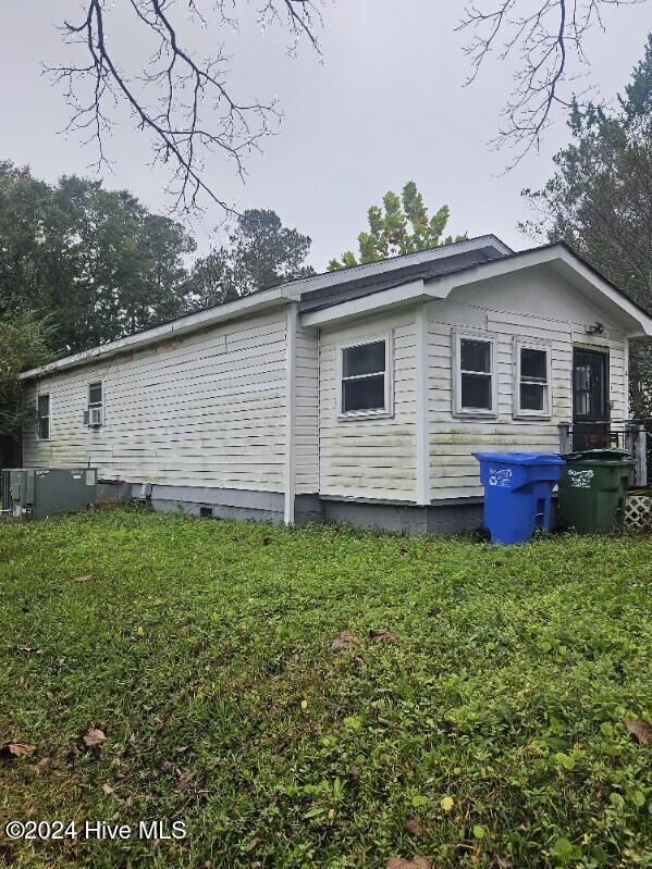 view of side of property featuring central AC unit