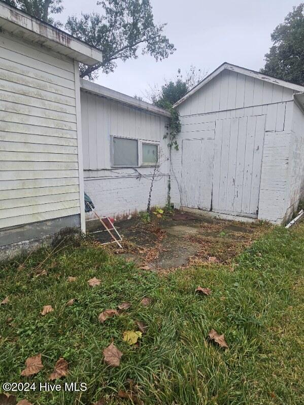 view of home's exterior featuring a storage shed