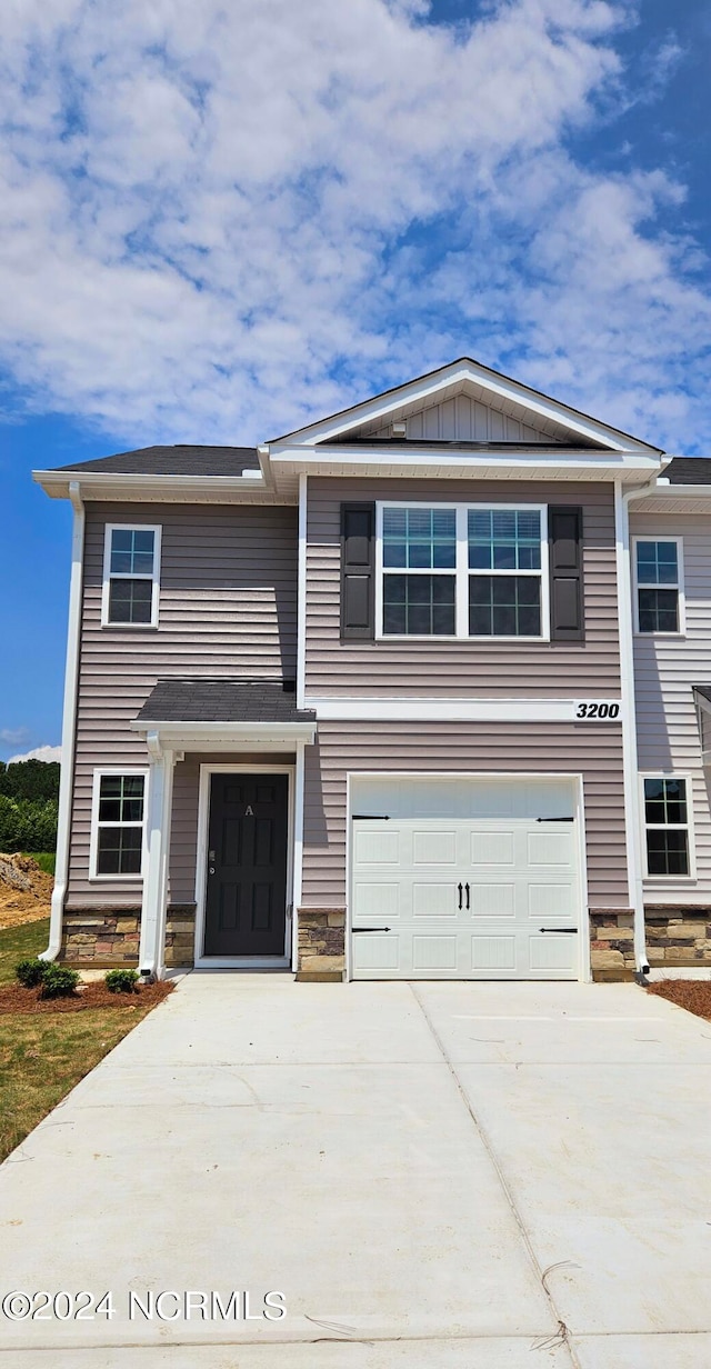 view of front of property with a garage