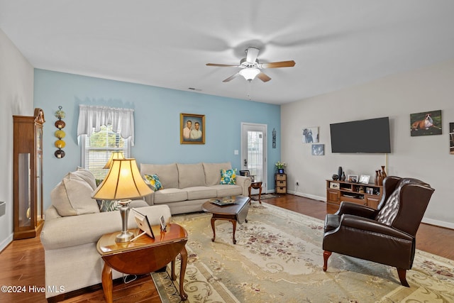 living room with hardwood / wood-style floors and ceiling fan