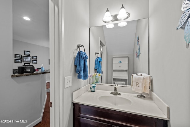 bathroom featuring vanity and wood-type flooring