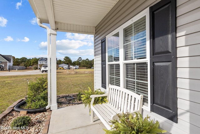 view of patio featuring a porch