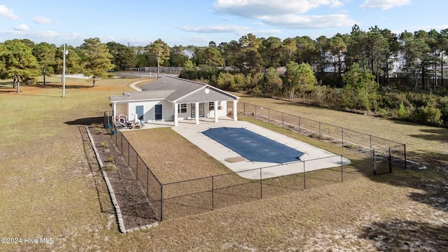 view of swimming pool with a lawn and a patio area