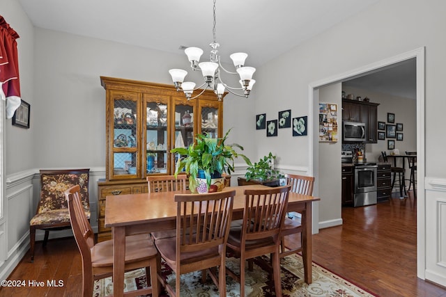 dining room with a chandelier and dark hardwood / wood-style floors