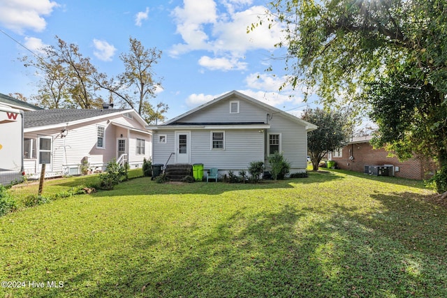 back of house with a yard