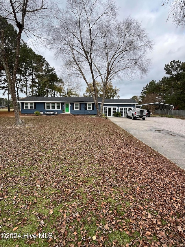 ranch-style house with a carport